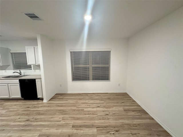 interior space featuring sink and light wood-type flooring