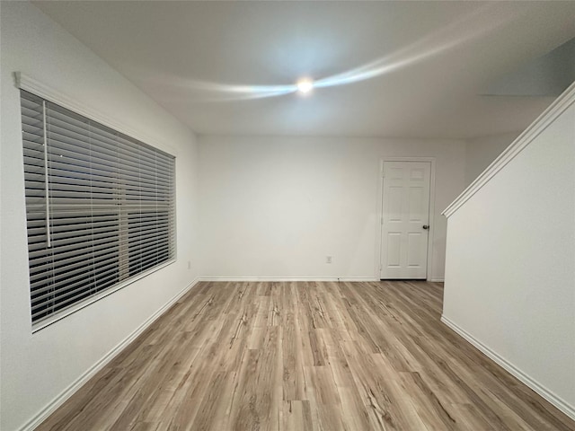 spare room with light hardwood / wood-style flooring