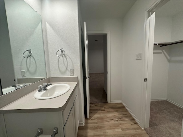 bathroom featuring vanity and wood-type flooring