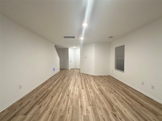 empty room with light hardwood / wood-style floors