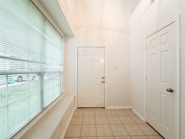 entryway featuring light tile patterned flooring and a wealth of natural light