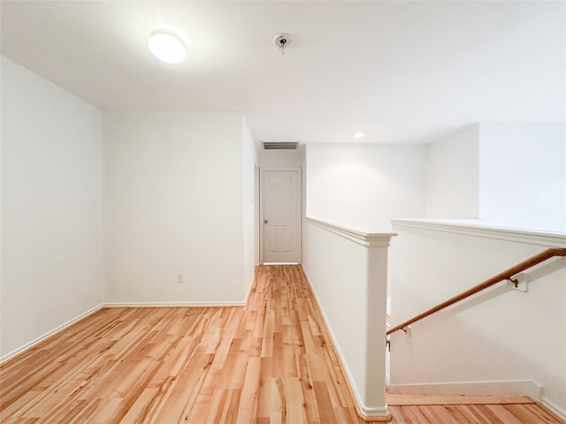 hallway with wood-type flooring