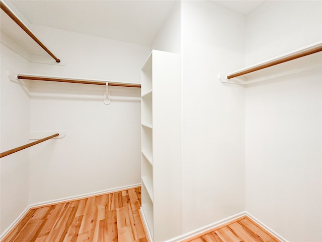 spacious closet featuring light hardwood / wood-style floors