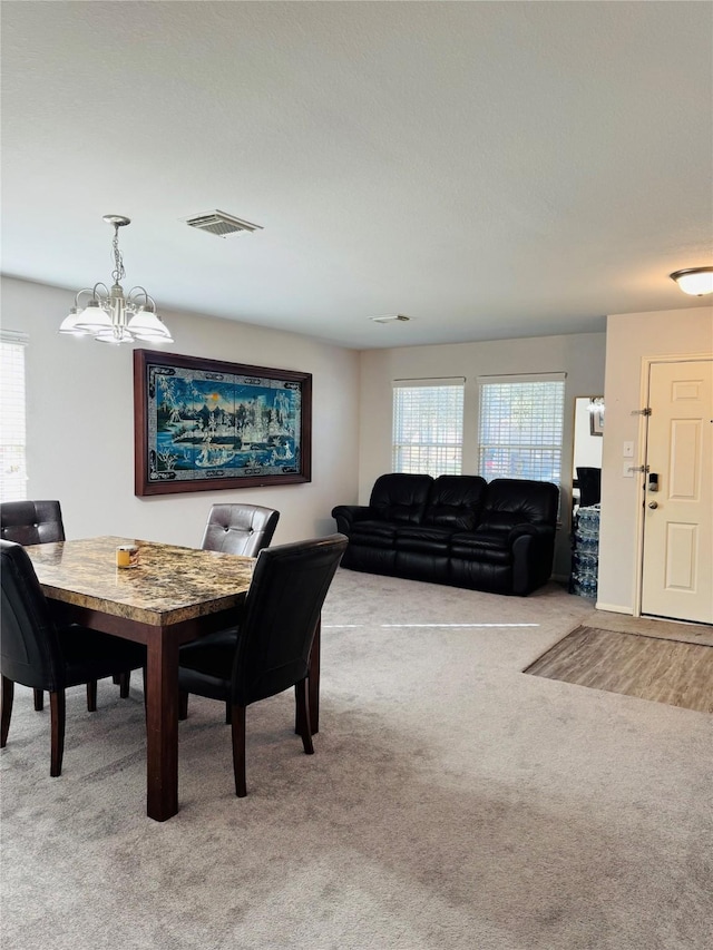 view of carpeted dining space