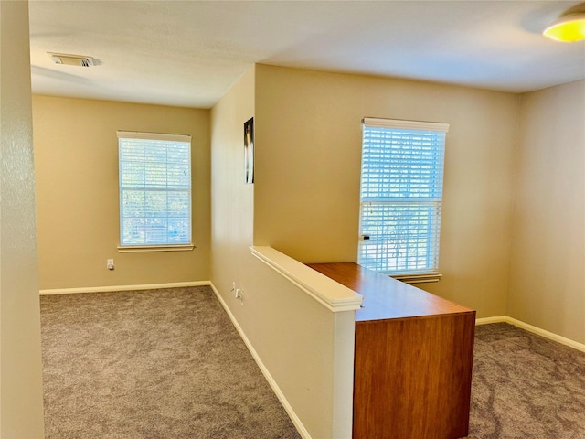 hall with carpet floors