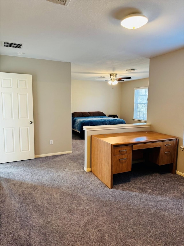 unfurnished bedroom featuring dark carpet