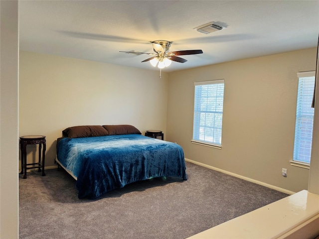 bedroom featuring ceiling fan and carpet