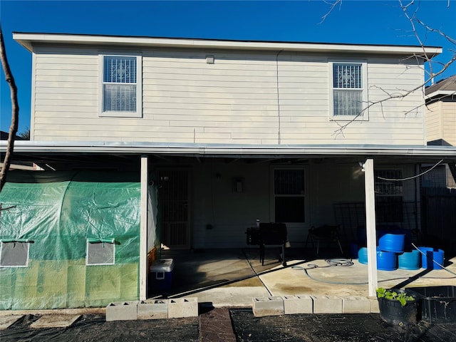 rear view of house featuring a patio