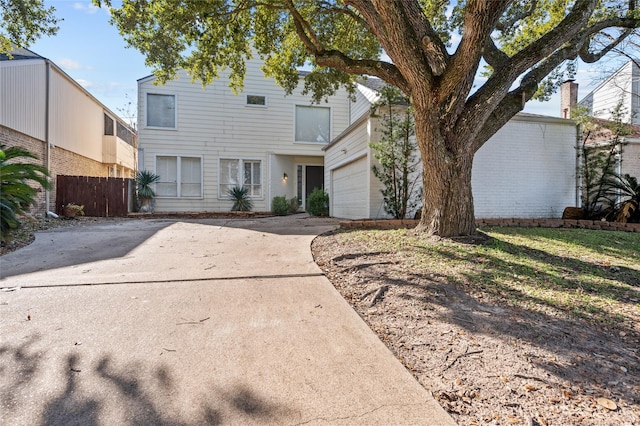 14323 Briarhills Pkwy, Houston, TX 77077 - view of front of property with concrete driveway and a garage