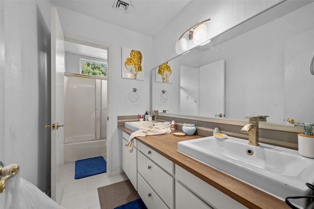 14323 Briarhills Pkwy, Houston, TX 77077 - full bathroom featuring double vanity, bathing tub / shower combination, and tile patterned flooring
