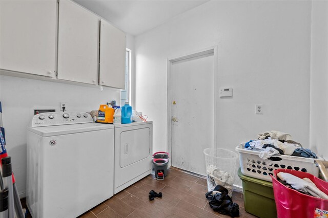 14323 Briarhills Pkwy, Houston, TX 77077 - laundry area featuring independent washer and dryer and cabinet space