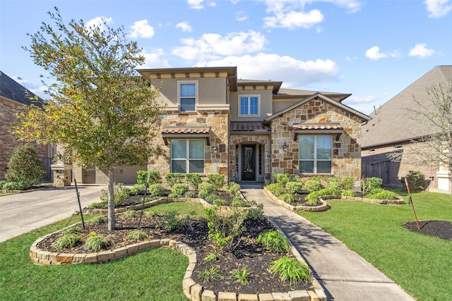 view of front of home with a garage and a front lawn