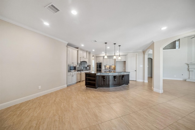 kitchen with pendant lighting, a kitchen island with sink, backsplash, stainless steel appliances, and ornamental molding