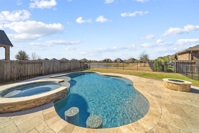 view of pool with a fire pit, a patio, and an in ground hot tub