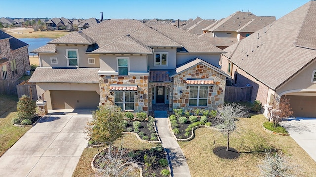 view of front of home featuring a garage and a front lawn