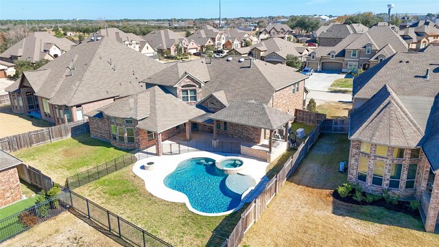 19031 Kimber Creek Ln, Cypress, TX 77429 - view of swimming pool featuring a residential view, a pool with connected hot tub, and a patio