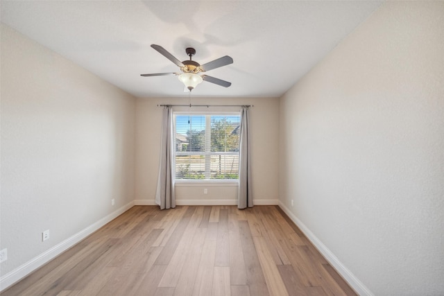 19031 Kimber Creek Ln, Cypress, TX 77429 - spare room with light wood finished floors, baseboards, and a ceiling fan