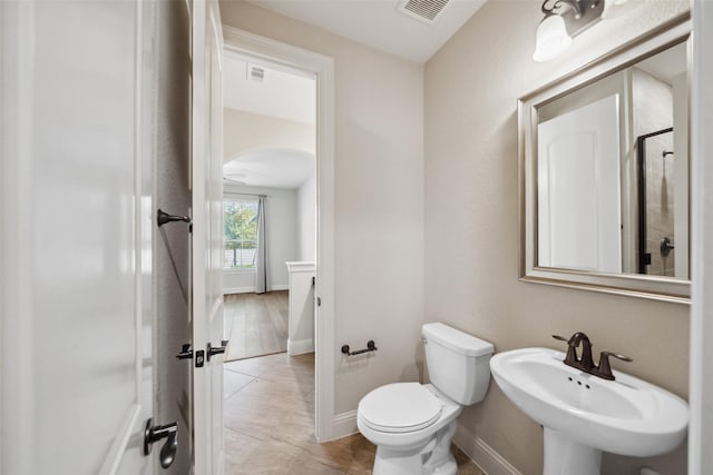 bathroom with sink, tile patterned floors, and toilet