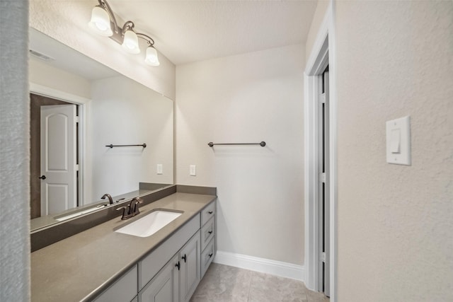 bathroom with vanity and tile patterned floors