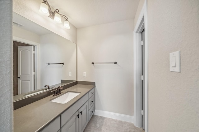 19031 Kimber Creek Ln, Cypress, TX 77429 - bathroom featuring vanity, tile patterned flooring, and baseboards