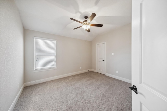 unfurnished room with lofted ceiling, carpet floors, and ceiling fan