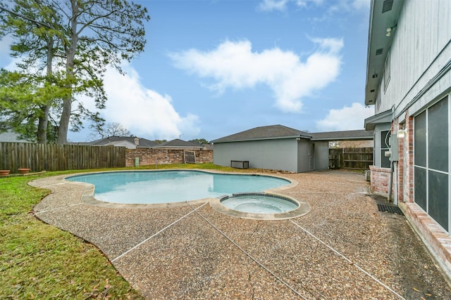 view of pool with a patio and an in ground hot tub