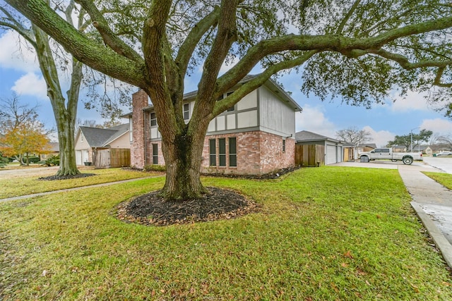 view of side of home featuring a garage and a yard