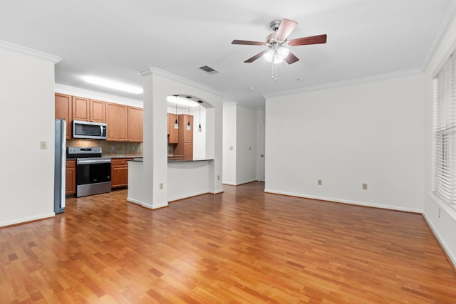 kitchen with tasteful backsplash, ceiling fan, light hardwood / wood-style floors, stainless steel appliances, and crown molding