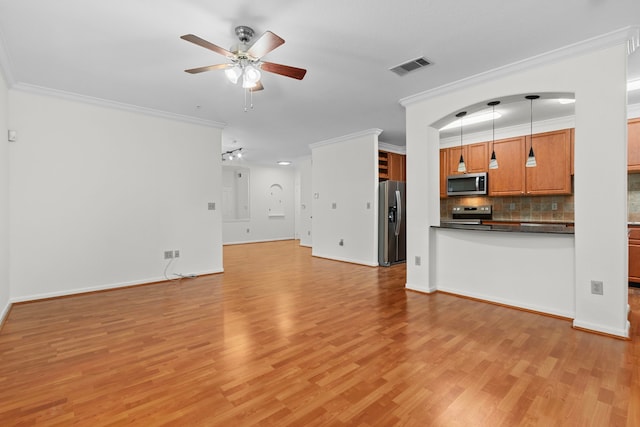 unfurnished living room featuring crown molding, ceiling fan, and light hardwood / wood-style flooring