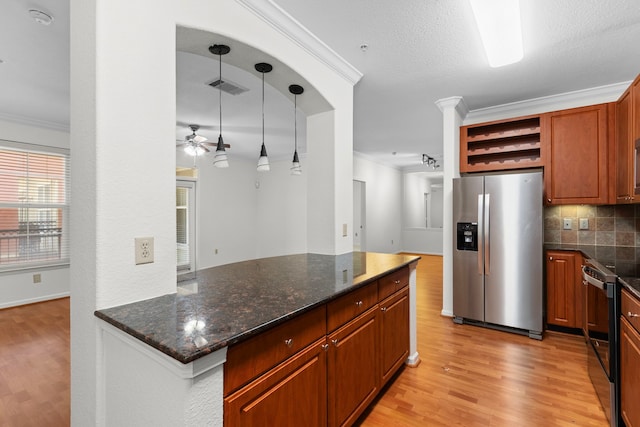 kitchen with decorative backsplash, ornamental molding, stainless steel appliances, and hanging light fixtures