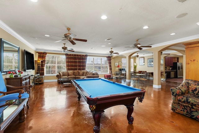 recreation room featuring crown molding and concrete floors