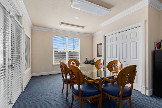 dining area featuring crown molding and dark colored carpet