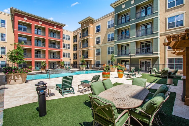 view of pool featuring a patio area