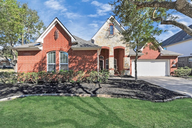 view of front facade featuring a garage and a front lawn