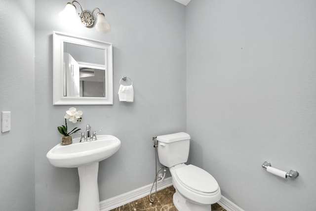 bathroom featuring toilet