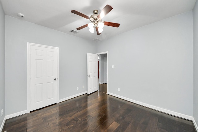 unfurnished bedroom with dark wood-type flooring and ceiling fan