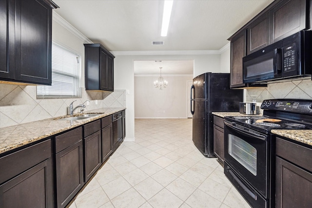 kitchen with decorative light fixtures, sink, ornamental molding, light tile patterned floors, and black appliances