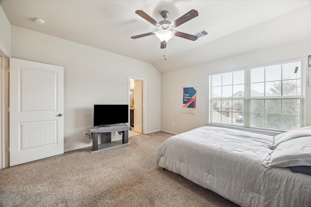 carpeted bedroom with vaulted ceiling and ceiling fan