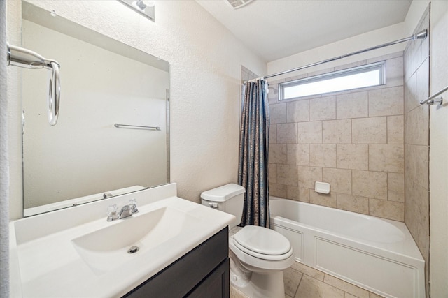 full bathroom featuring tile patterned flooring, vanity, shower / tub combo, and toilet