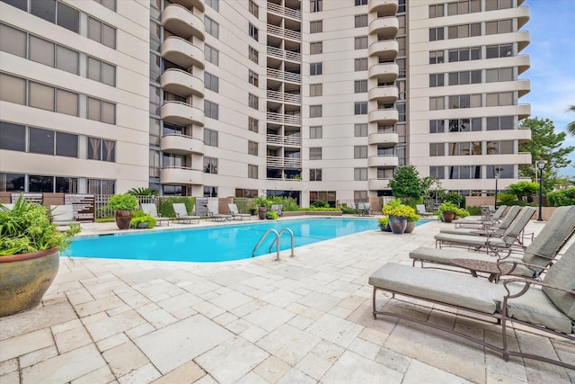 view of swimming pool featuring a patio