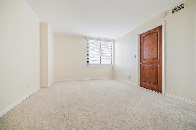 carpeted empty room with crown molding