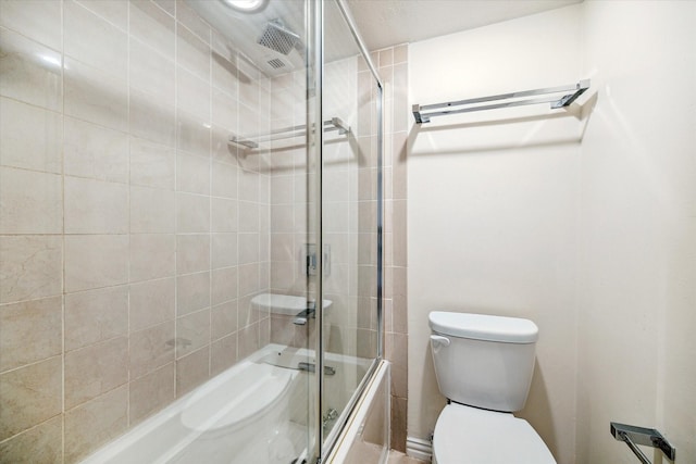 bathroom with enclosed tub / shower combo and toilet