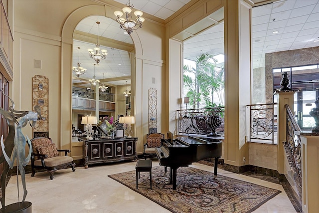 miscellaneous room with a notable chandelier and crown molding