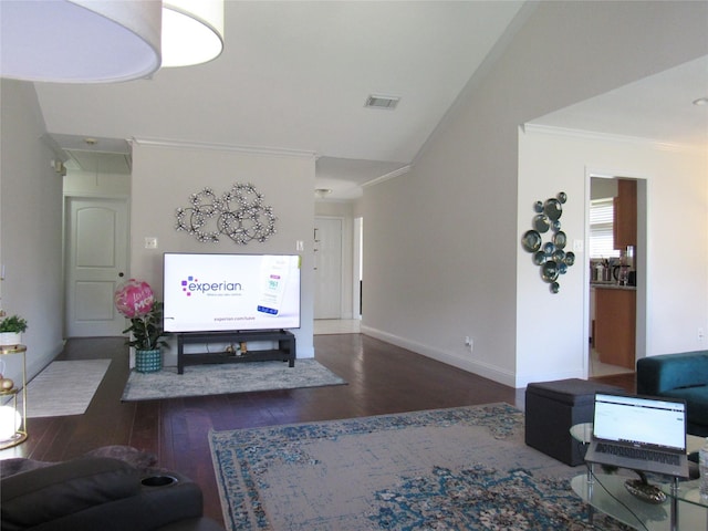 living room featuring ornamental molding, lofted ceiling, and dark hardwood / wood-style flooring