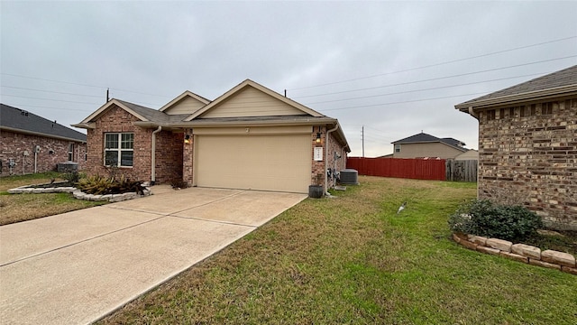 view of front facade with central AC unit, a garage, and a front lawn