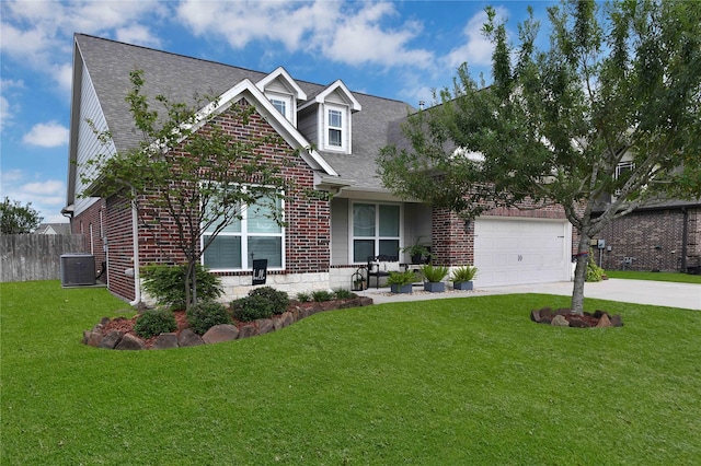 view of front of house featuring a garage, central AC, and a front lawn