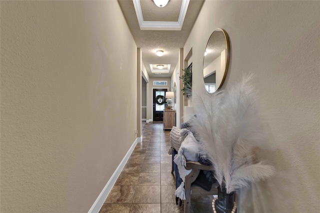 hall with dark tile patterned flooring and a textured ceiling