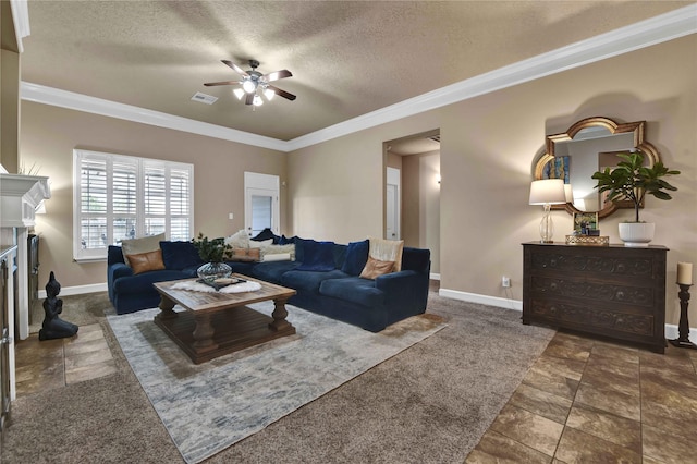 living room featuring crown molding, ceiling fan, a fireplace, and a textured ceiling