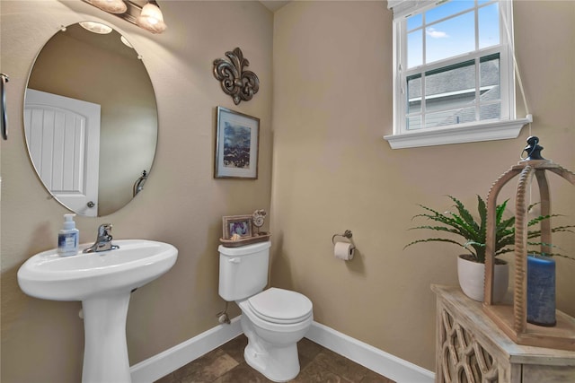 bathroom featuring tile patterned flooring and toilet