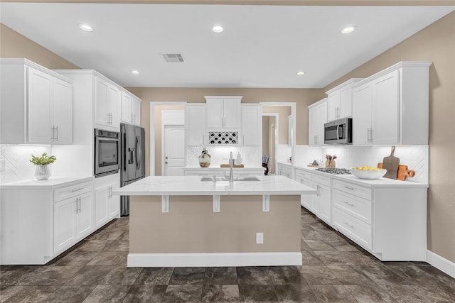 kitchen featuring white cabinetry, appliances with stainless steel finishes, and sink